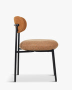 Fauteuil rétro Boucle avec 3 coloris et format polyvalent pour salon et salle à manger